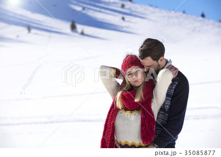Happy couple playful together during winter 35085877