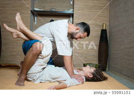 man and woman in white doing gymnastics 35091151