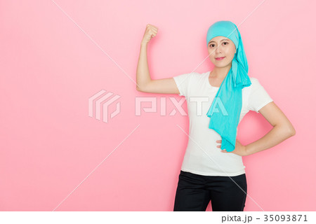cancer woman showing powerful strength muscle 35093871
