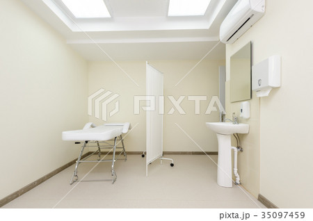 Massage room with empty table 35097459