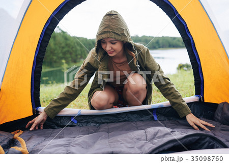 Preparing tent for sleeping Preparing tent for sleeping 35098760