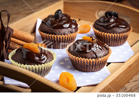 Freshly baked chocolate muffins. Freshly baked chocolate muffins. 35100468