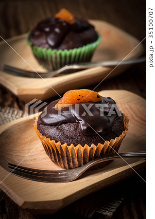 Freshly baked chocolate muffins. Freshly baked chocolate muffins. 35100707