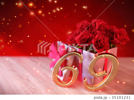 birthday concept with red roses in gift on wooden 35101231