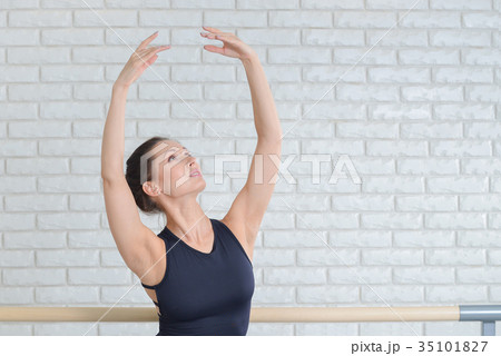 Ballerina practicing dance at ballet studio near 35101827