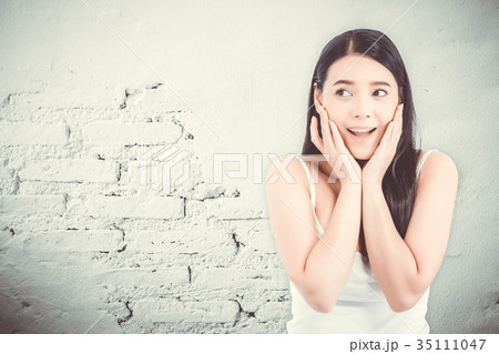 Asian woman surprise hold cheek with hand Asian woman surprise hold cheek with hand 35111047