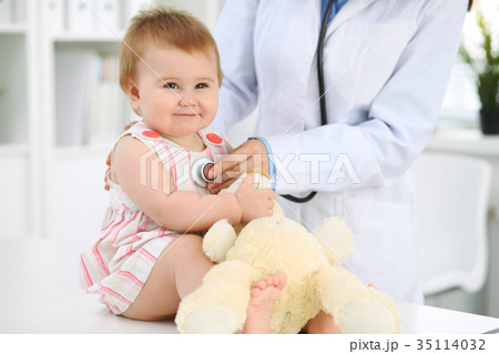Doctor and patient. Happy cute baby  at health exa 35114032