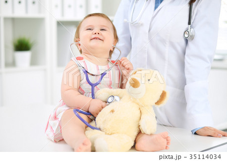 Doctor and patient. Happy cute baby  at health exa 35114034