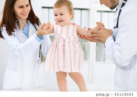 Doctor and patient. Happy cute baby  at health exa 35114035