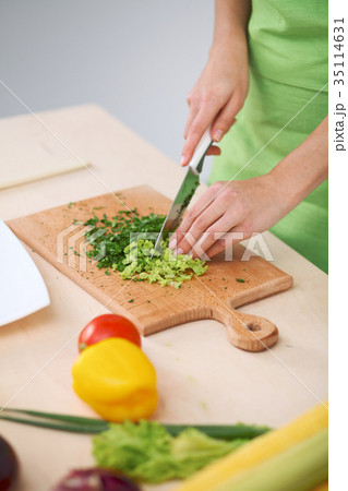 Close-up of human hands cooking vegetables salad Close-up of human hands cooking vegetables salad 35114631