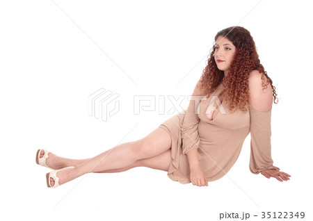 Beautiful woman sitting on floor 35122349