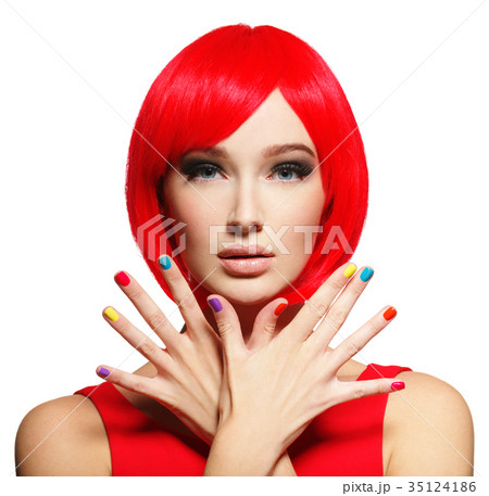 Closeup face of a beautiful  girl with  multicolor nails. 35124186
