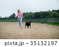 smiling girl relaxing with dog. 35132197