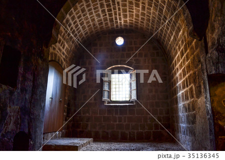 Window on the old building from rough stone 35136345