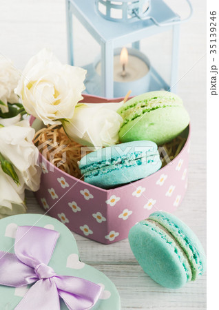 Arrangement of blue lanter, flowers, macaroons Arrangement of blue lanter, flowers, macaroons 35139246
