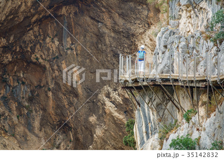 El Caminito del Rey footpath with tourist walking 35142832