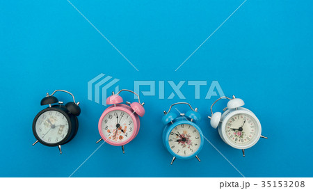 Flat lay retro beautiful new alarm clock on blue  35153208