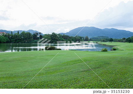 Golf course green grass field and lagoon Golf course green grass field and lagoon 35153230