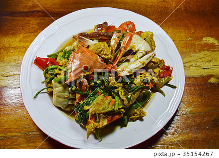 stir fried flower crab with yellow curry on dish stir fried flower crab with yellow curry on dish 35154267