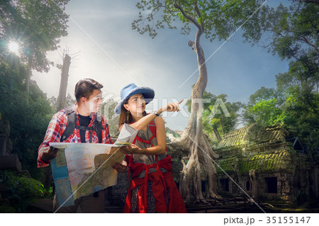 Traveler finding next camping point by a map 35155147