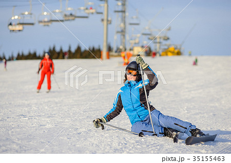 Young woman skier after the fall on mountain slope 35155463