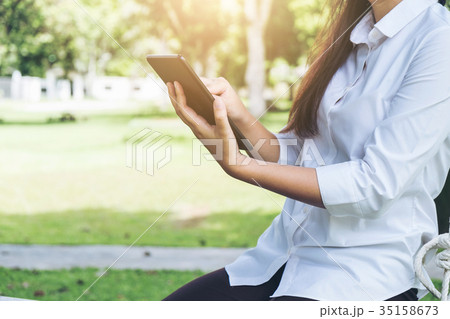 Work and relax, Woman freelancer is working on digital tablet, w 35158673