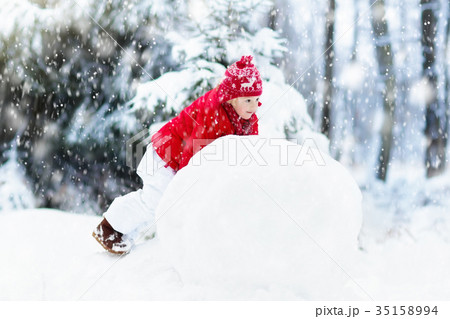 Kids building snowman. Children in snow Winter fun Kids building snowman. Children in snow Winter fun 35158994
