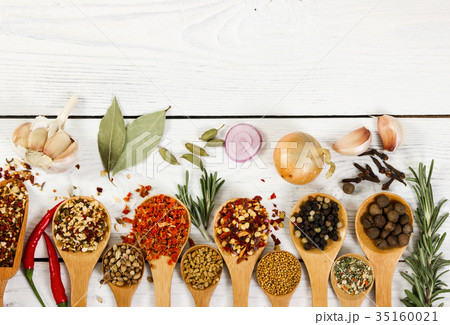 Different spices in wooden spoon. Top view. 35160021