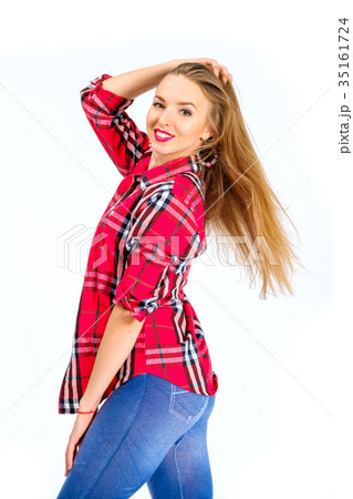 Young sexy woman dressed in jeans and checkered 35161724