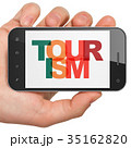Tourism concept: Hand Holding Smartphone with 35162820