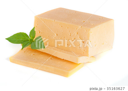 cheese with basil leaves isolated on white 35163627