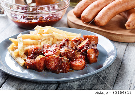 Traditional German currywurst - pieces of sausage Traditional German currywurst - pieces of sausage 35164315