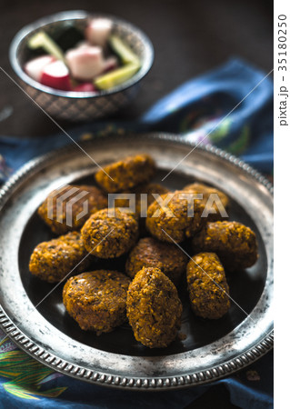 Falafel on a vintage tin plate and a salad of Falafel on a vintage tin plate and a salad of 35180250