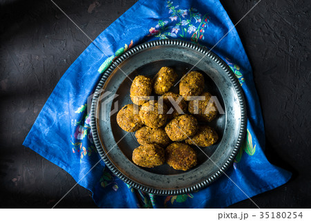 Vegan falafel on a tin plate on a blue napkin 35180254