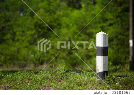 Pillar black and white symbol on the road Pillar black and white symbol on the road 35181665