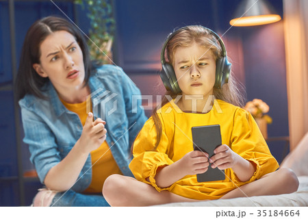 Mother is scolding her child Mother is scolding her child 35184664