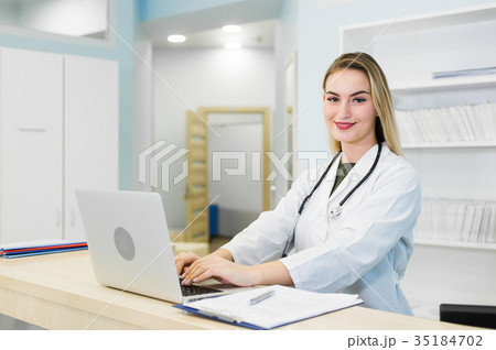 Young smiling receptionist in dental clinic 35184702
