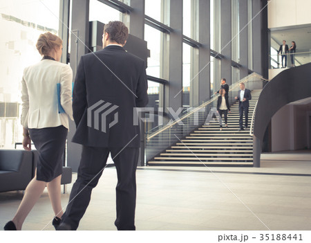 Business people at hall of office building 35188441