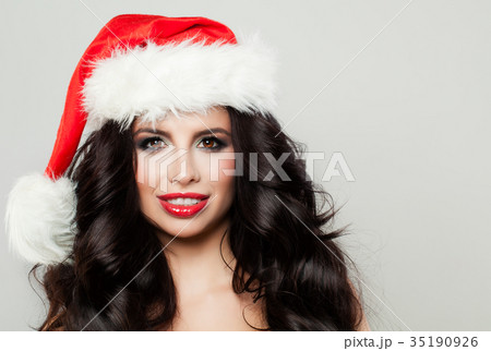Happy Woman with Christmas Hat. Winter and Holiday 35190926