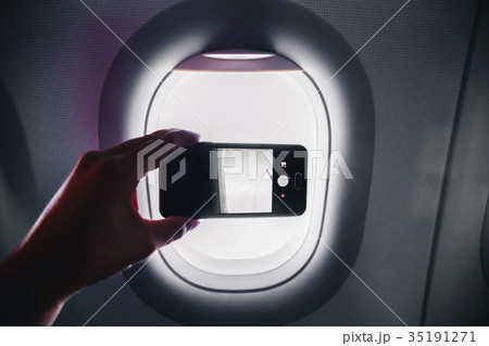 passanger makes photos on the smartphone in the 35191271