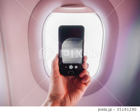 passanger makes photos on the smartphone in the passanger makes photos on the smartphone in the 35191290
