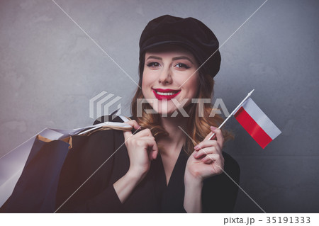 girl in hat with shopping bags and flag of Poland 35191333