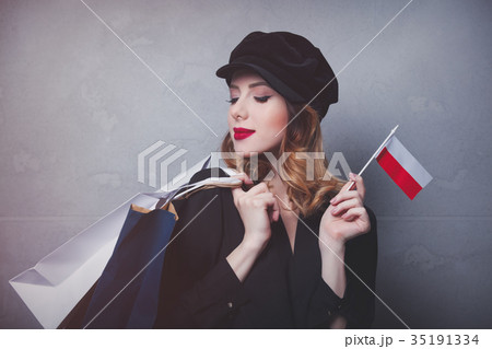 girl in hat with shopping bags and flag of Poland 35191334