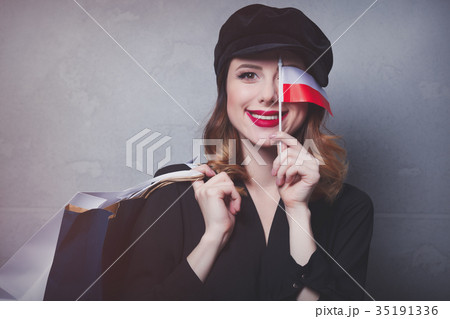girl in hat with shopping bags and flag of Poland girl in hat with shopping bags and flag of Poland 35191336
