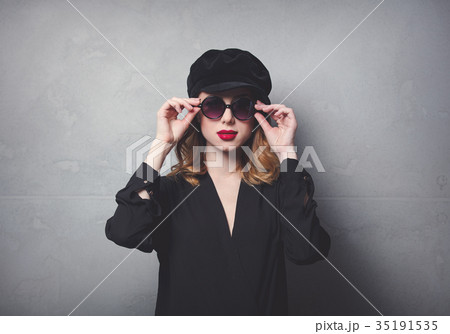 Style redhead girl in black hat and clothes 35191535