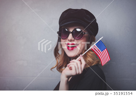 girl with flag of USA on grey background 35191554
