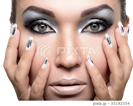 Beautiful girl with the silver makeup and nails. Beautiful girl with the silver makeup and nails. 35192354