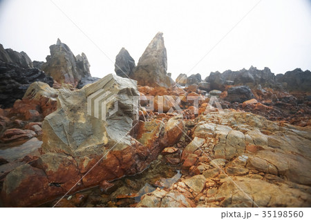 Large stones lie on the shore 35198560