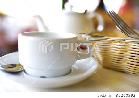Kettle and a cup on the table Kettle and a cup on the table 35200592
