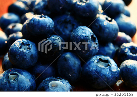 fresh berries blueberries close-up scattered 35201158